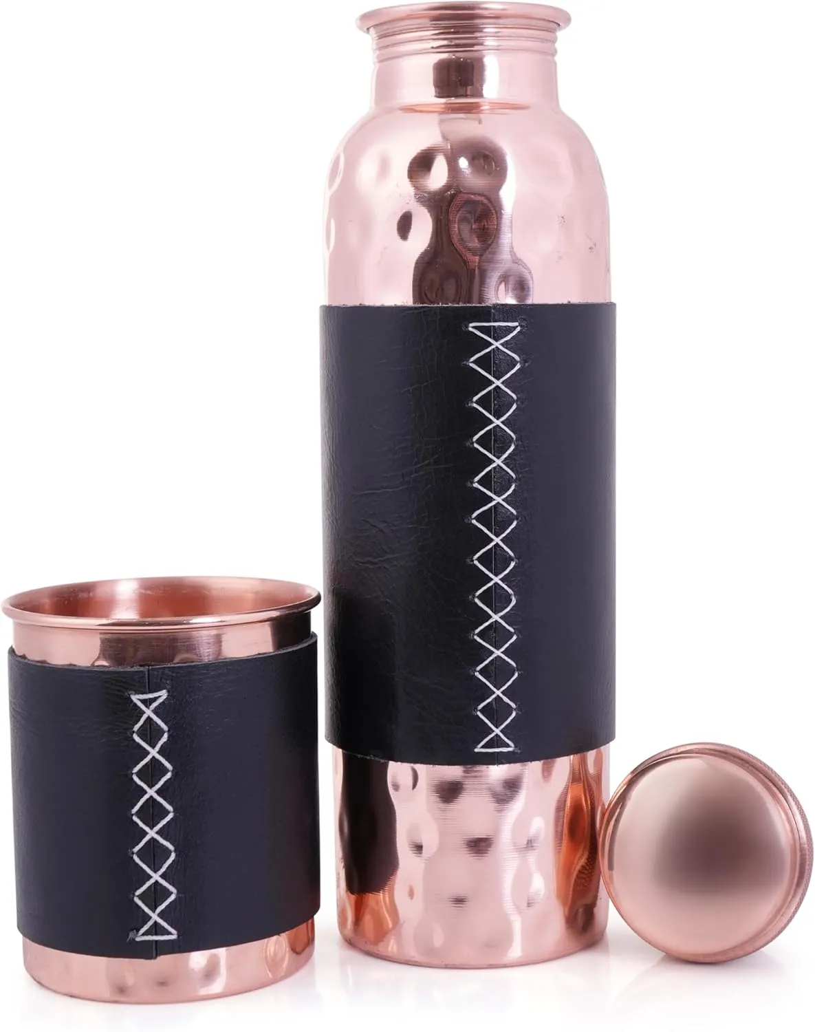 Artisan Copper 100% Pure Copper Bottle (32oz/950ml) & Tumbler with leather sleeves. Handcrafted, hammered finish, leak-proof, lab-tested, and Ayurvedic. Perfect for hydration, gifting, and daily use.
